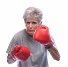 Grandmother with boxing gloves on